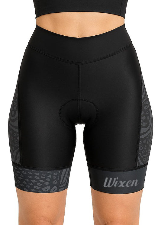 Detail of stitching and leg grippers on black cycling shorts for women